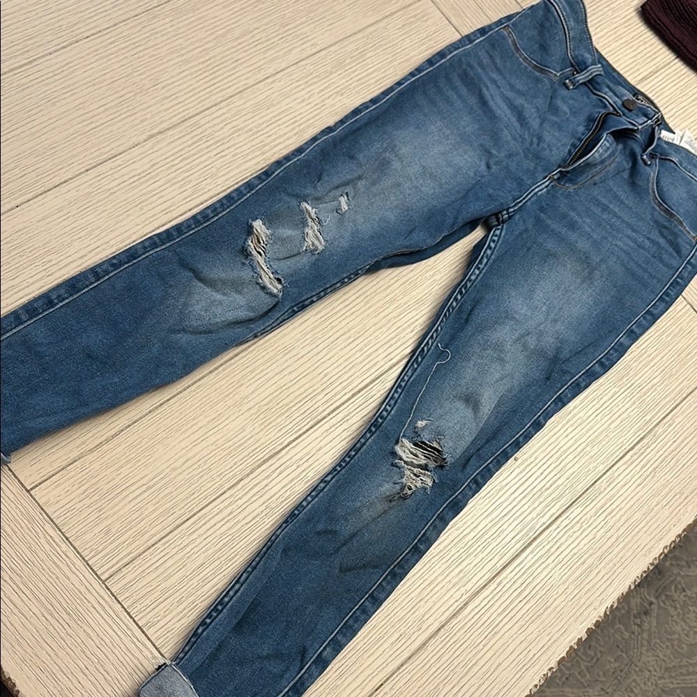 Woman’s Blue Distressed Jeans